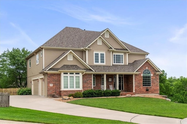 2704 SW Gray Ln, Lees Summit, MO 64081 - view of front facade featuring an attached garage, brick siding, concrete driveway, and a porch
