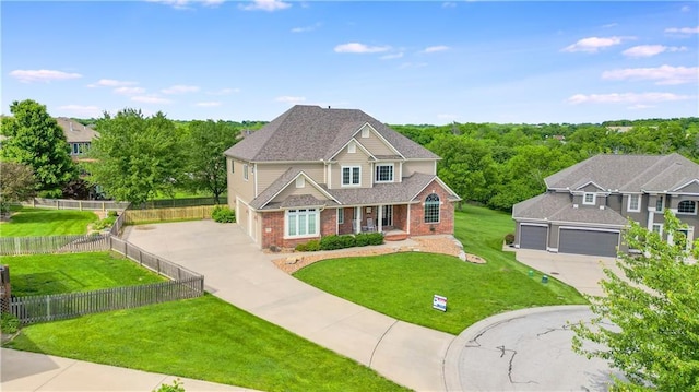2704 SW Gray Ln, Lees Summit, MO 64081 - view of front of home with driveway, brick siding, an attached garage, covered porch, and a shingled roof