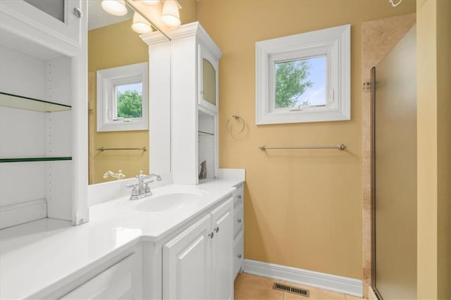 2704 SW Gray Ln, Lees Summit, MO 64081 - full bath featuring vanity, a shower stall, baseboards, and tile patterned floors