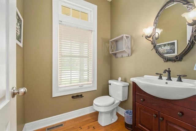 2704 SW Gray Ln, Lees Summit, MO 64081 - bathroom featuring vanity, toilet, baseboards, and wood finished floors