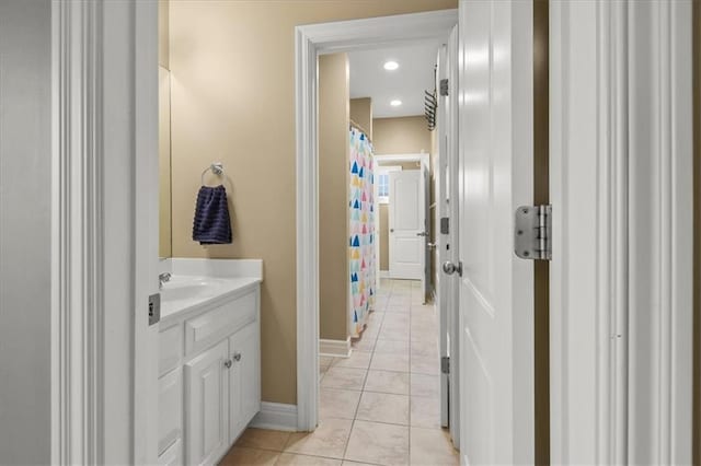 2704 SW Gray Ln, Lees Summit, MO 64081 - full bath with vanity, tile patterned floors, baseboards, recessed lighting, and a shower with shower curtain