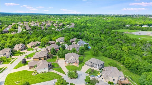 2704 SW Gray Ln, Lees Summit, MO 64081 - aerial perspective of suburban area featuring a heavily wooded area