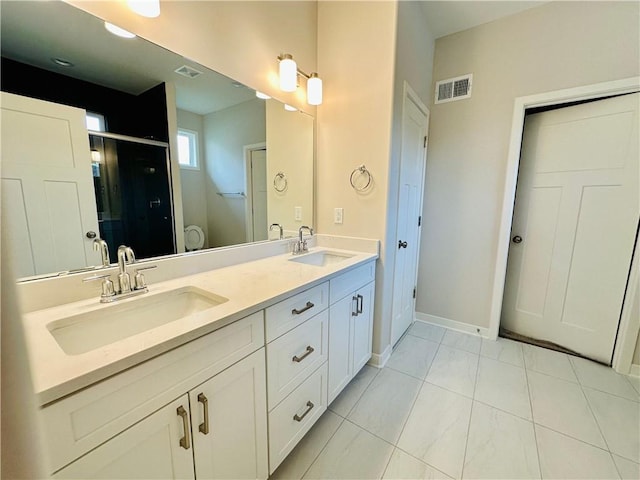 full bathroom featuring a sink, a shower stall, double vanity, and visible vents