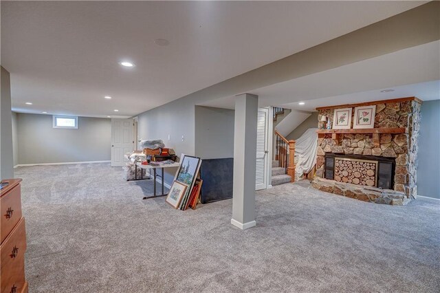 below grade area featuring carpet flooring, recessed lighting, and stairs