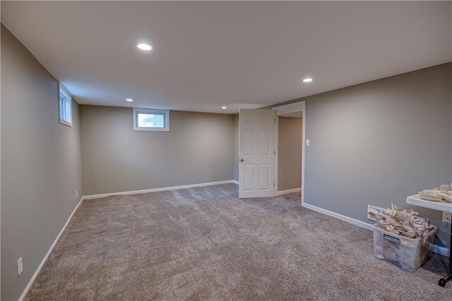 below grade area featuring carpet floors, baseboards, and recessed lighting