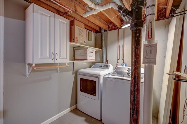 laundry area featuring baseboards and washer and dryer