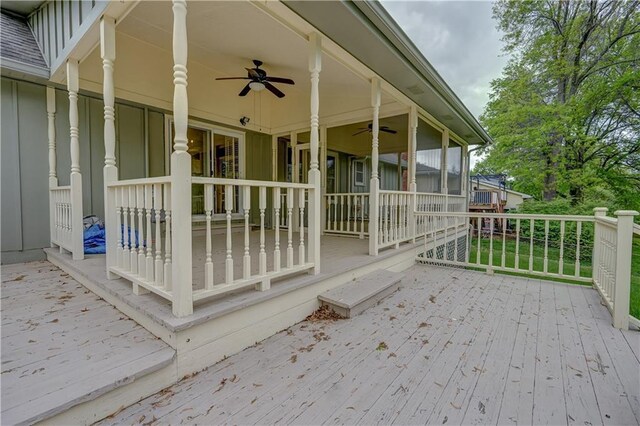 wooden deck featuring ceiling fan