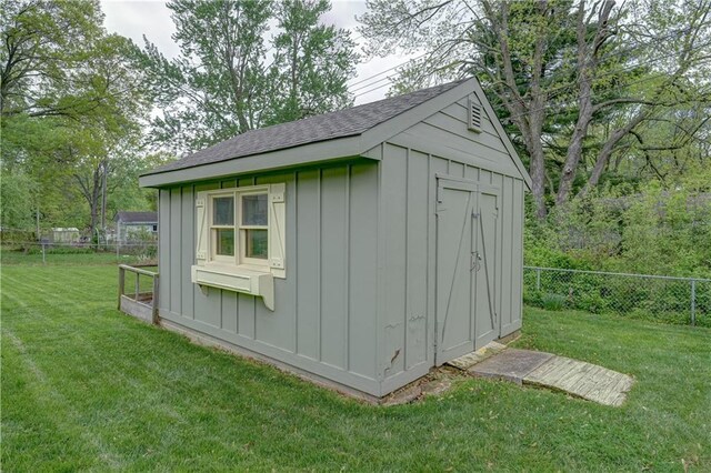 view of shed with fence