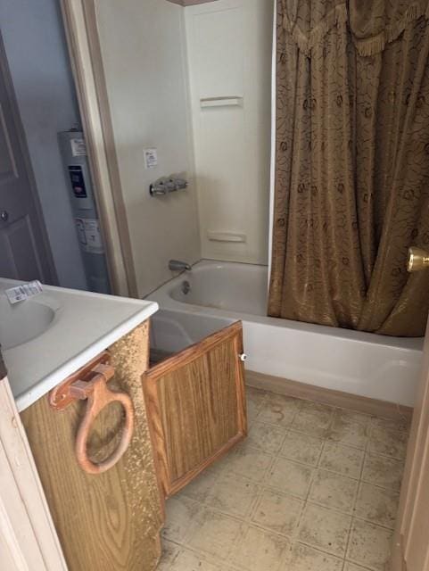 420 S Lincoln Ave, Chanute, KS 66720 - full bath with tile patterned floors, shower / bath combo, and vanity