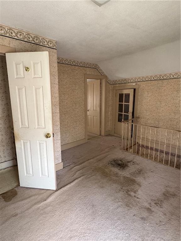 420 S Lincoln Ave, Chanute, KS 66720 - carpeted spare room with lofted ceiling