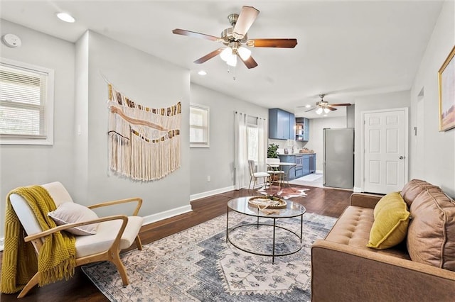4331 Virginia Ave, Kansas City, MO 64110 - living area featuring plenty of natural light, a ceiling fan, baseboards, wood finished floors, and recessed lighting