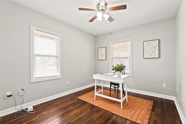 4331 Virginia Ave, Kansas City, MO 64110 - home office featuring ceiling fan, baseboards, and wood finished floors