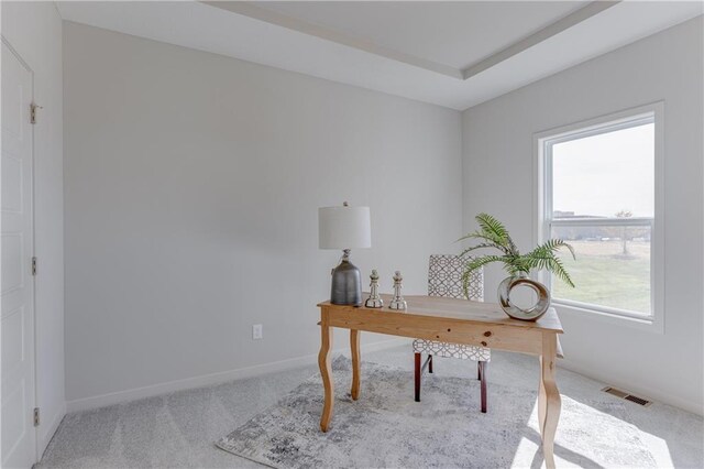 carpeted office featuring baseboards, visible vents, and plenty of natural light