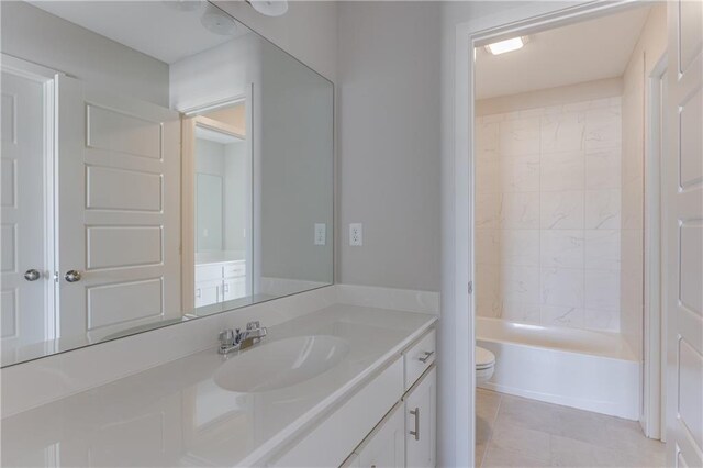 bathroom with toilet, shower / bathing tub combination, tile patterned flooring, and vanity