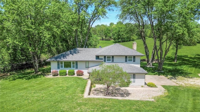 10946 Hubbard Rd, Kansas City, KS 66109 - tri-level home with a front lawn, a chimney, and roof with shingles