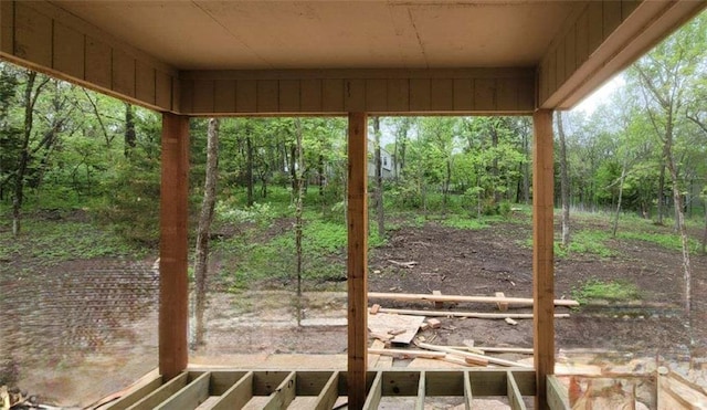 exterior space with a forest view