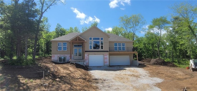 1604 Stonewall St, Oak Grove, MO 64075 - view of front of property with an attached garage, driveway, and french doors
