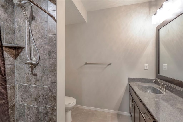 3525 S Woodland Ct, Independence, MO 64052 - bathroom with tile patterned flooring, vanity, toilet, baseboards, and tiled shower
