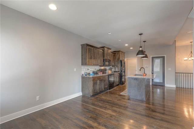 3525 S Woodland Ct, Independence, MO 64052 - kitchen with a sink, baseboards, black appliances, and dark wood finished floors