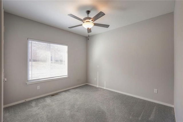 3525 S Woodland Ct, Independence, MO 64052 - carpeted spare room featuring baseboards, visible vents, and ceiling fan