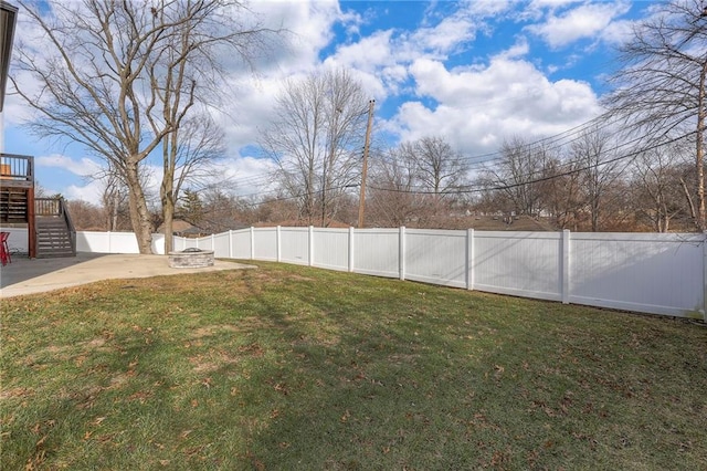 3525 S Woodland Ct, Independence, MO 64052 - view of yard featuring a wooden deck, a patio area, a fenced backyard, a fire pit, and stairs