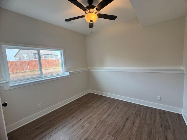 15610 Sheridan Ct, Basehor, KS 66007 - spare room featuring dark wood-style flooring, baseboards, and ceiling fan