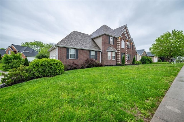 2500 Gabrianna Ct, Columbia, MO 65203 - traditional home with brick siding, a shingled roof, and a front yard
