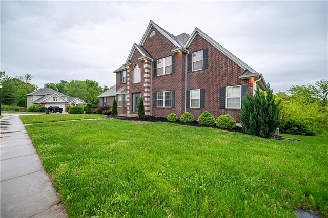 2500 Gabrianna Ct, Columbia, MO 65203 - traditional-style house featuring brick siding and a front yard