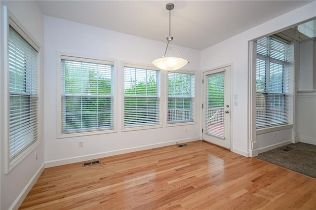 2500 Gabrianna Ct, Columbia, MO 65203 - unfurnished dining area featuring baseboards, plenty of natural light, and light wood-type flooring