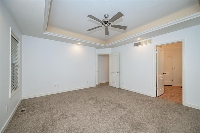 2500 Gabrianna Ct, Columbia, MO 65203 - unfurnished bedroom with carpet floors, a raised ceiling, baseboards, and visible vents