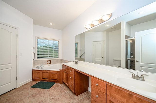 2500 Gabrianna Ct, Columbia, MO 65203 - bathroom featuring double vanity, toilet, a sink, and a garden tub
