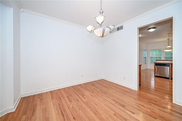 2500 Gabrianna Ct, Columbia, MO 65203 - spare room featuring baseboards, ornamental molding, light wood finished floors, and a chandelier