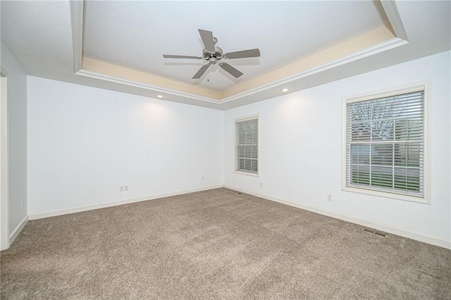 2500 Gabrianna Ct, Columbia, MO 65203 - unfurnished room with visible vents, baseboards, a raised ceiling, a ceiling fan, and carpet