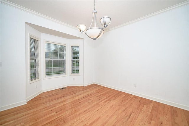 2500 Gabrianna Ct, Columbia, MO 65203 - unfurnished room with an inviting chandelier, ornamental molding, light wood-style floors, and baseboards