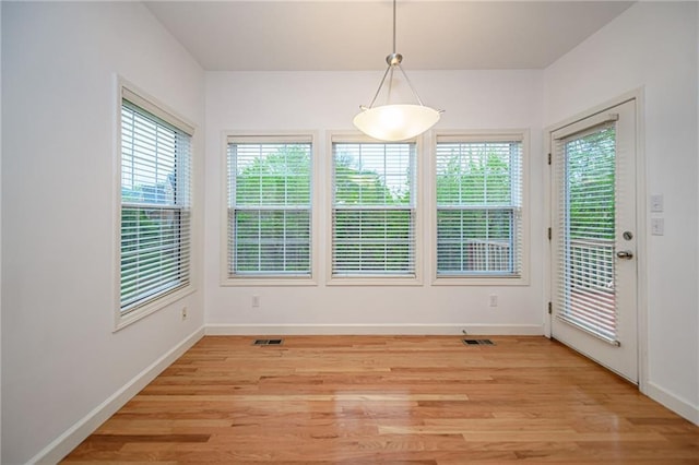 2500 Gabrianna Ct, Columbia, MO 65203 - unfurnished dining area featuring baseboards, visible vents, and light wood-style floors