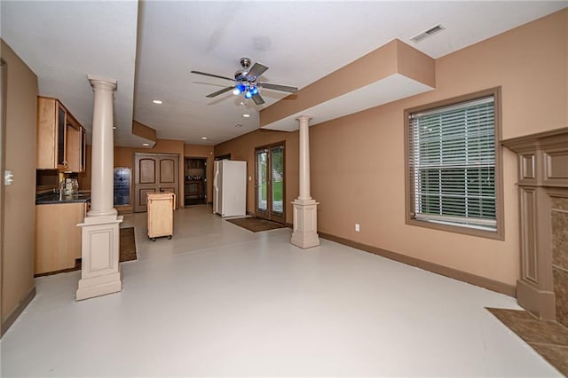 2500 Gabrianna Ct, Columbia, MO 65203 - unfurnished living room with visible vents, a ceiling fan, decorative columns, and concrete flooring