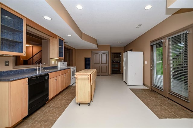2500 Gabrianna Ct, Columbia, MO 65203 - kitchen with freestanding refrigerator, light brown cabinets, glass insert cabinets, dishwasher, and range with electric cooktop