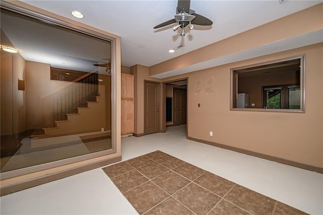 2500 Gabrianna Ct, Columbia, MO 65203 - basement with a ceiling fan, stairs, baseboards, freestanding refrigerator, and recessed lighting