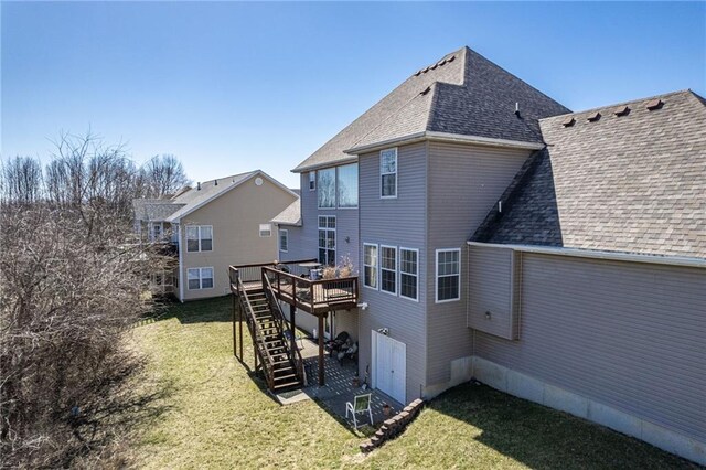 2500 Gabrianna Ct, Columbia, MO 65203 - rear view of property featuring roof with shingles, a wooden deck, a yard, and stairway