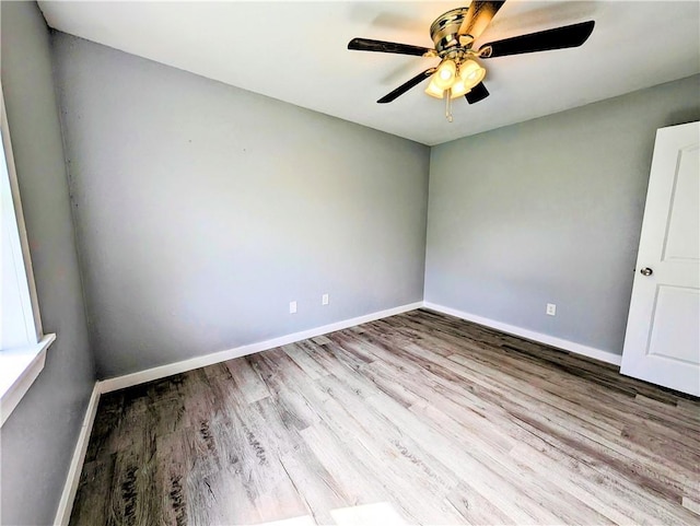 597 SE 110th St, Warrensburg, MO 64093 - spare room featuring baseboards, ceiling fan, and wood finished floors