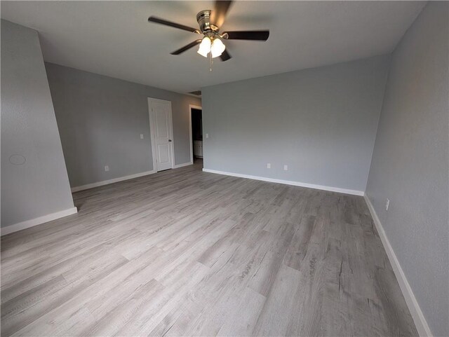 597 SE 110th St, Warrensburg, MO 64093 - empty room featuring baseboards, ceiling fan, and wood finished floors