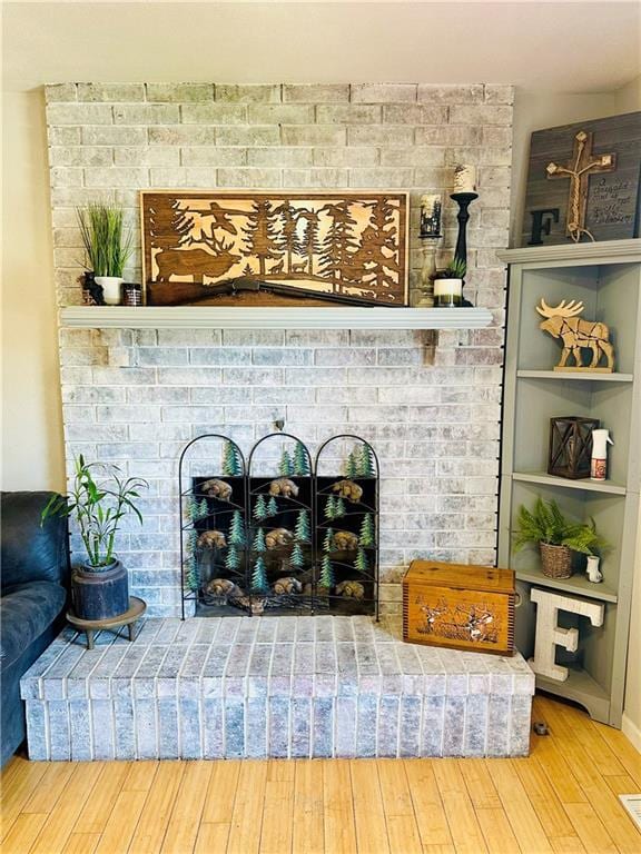 details with wood finished floors and a fireplace