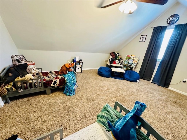bedroom with carpet flooring, ceiling fan, baseboards, and lofted ceiling