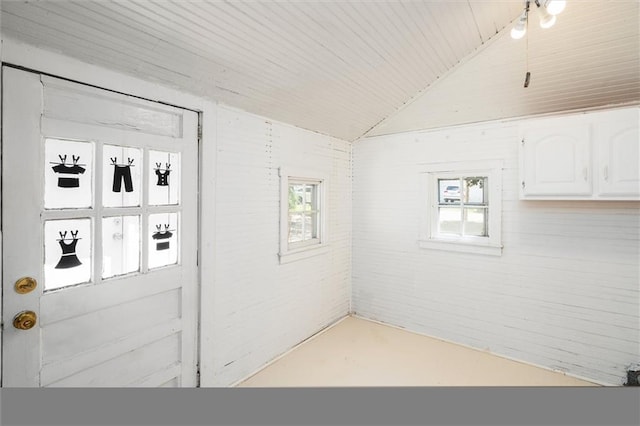 interior space with healthy amount of natural light, lofted ceiling, and wooden ceiling