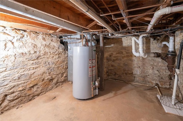 unfinished basement featuring gas water heater