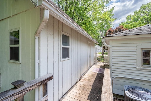 view of home's exterior featuring a deck and central AC