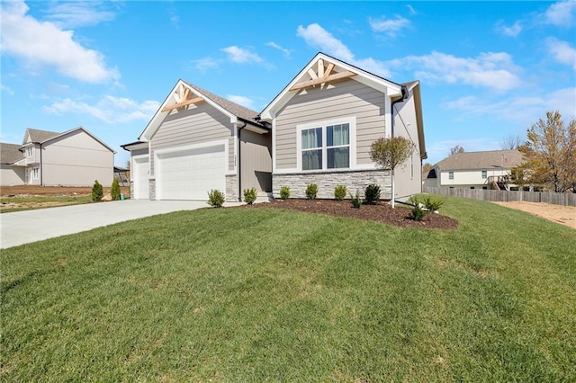 craftsman-style home featuring fence, an attached garage, a front lawn, stone siding, and concrete driveway