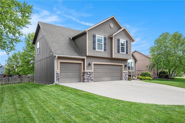 view of front of home with stone siding, driveway, a garage, and roof with shingles