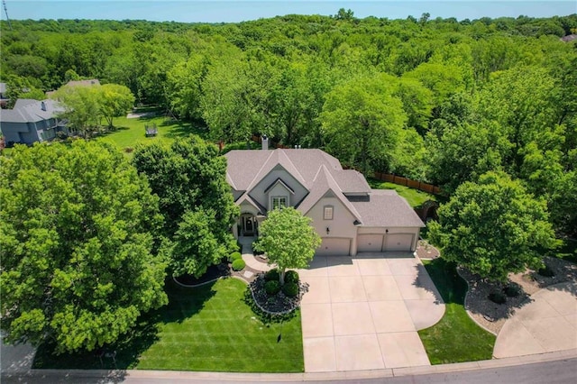 7419 Constance St, Shawnee, KS 66216 - view from above of property with a heavily wooded area