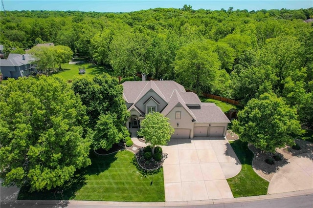 7419 Constance St, Shawnee, KS 66216 - aerial view of property and surrounding area with a forest